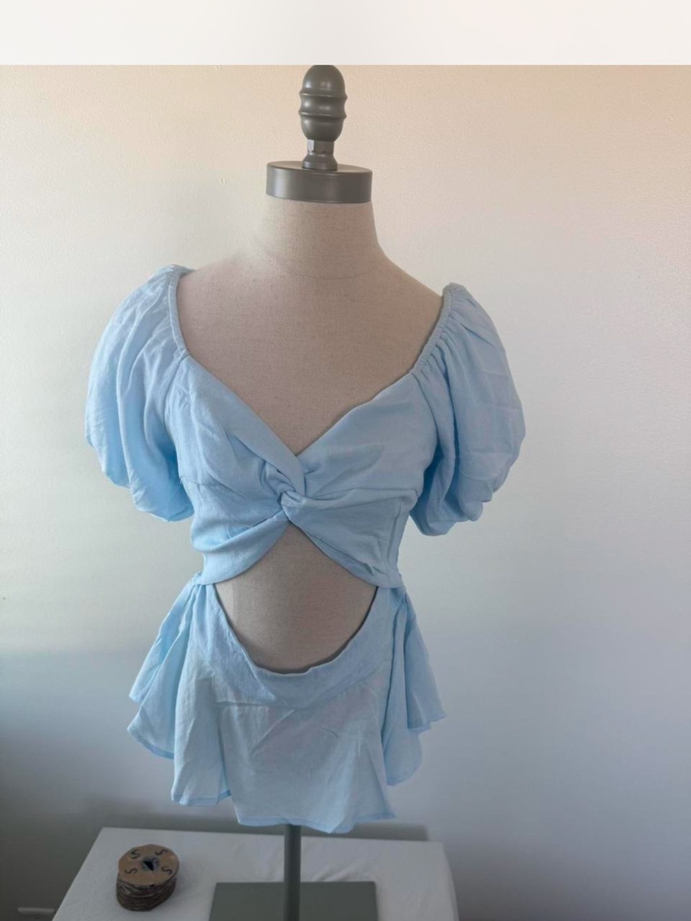 Francesca’s new with tags Light Blue Twist-Front Cutout Top